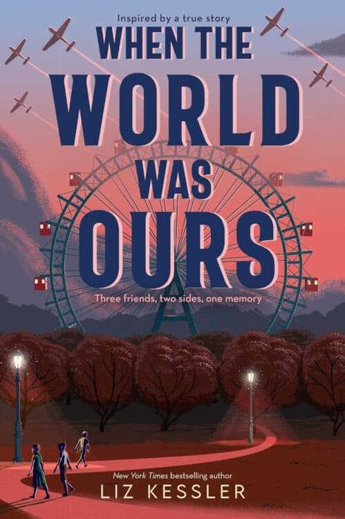 Book cover for When the World Was Ours by Liz Kessler, showing a large Ferris wheel at sunset with fighter planes flying overhead and three children walking along a path in a park. The tagline reads “Three friends, two sides, one memory,” and the cover notes it is inspired by a true story.