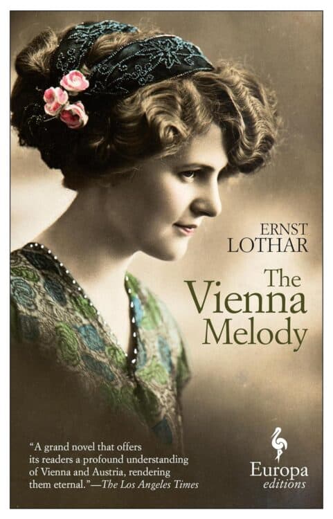 Cover of The Vienna Melody by Ernst Lothar, featuring a vintage-style portrait of a woman in profile with softly curled hair, adorned with pink roses and a beaded headband. She wears a patterned dress in green and blue tones, with a quote from The Los Angeles Times praising the novel’s depiction of Vienna and Austria.
